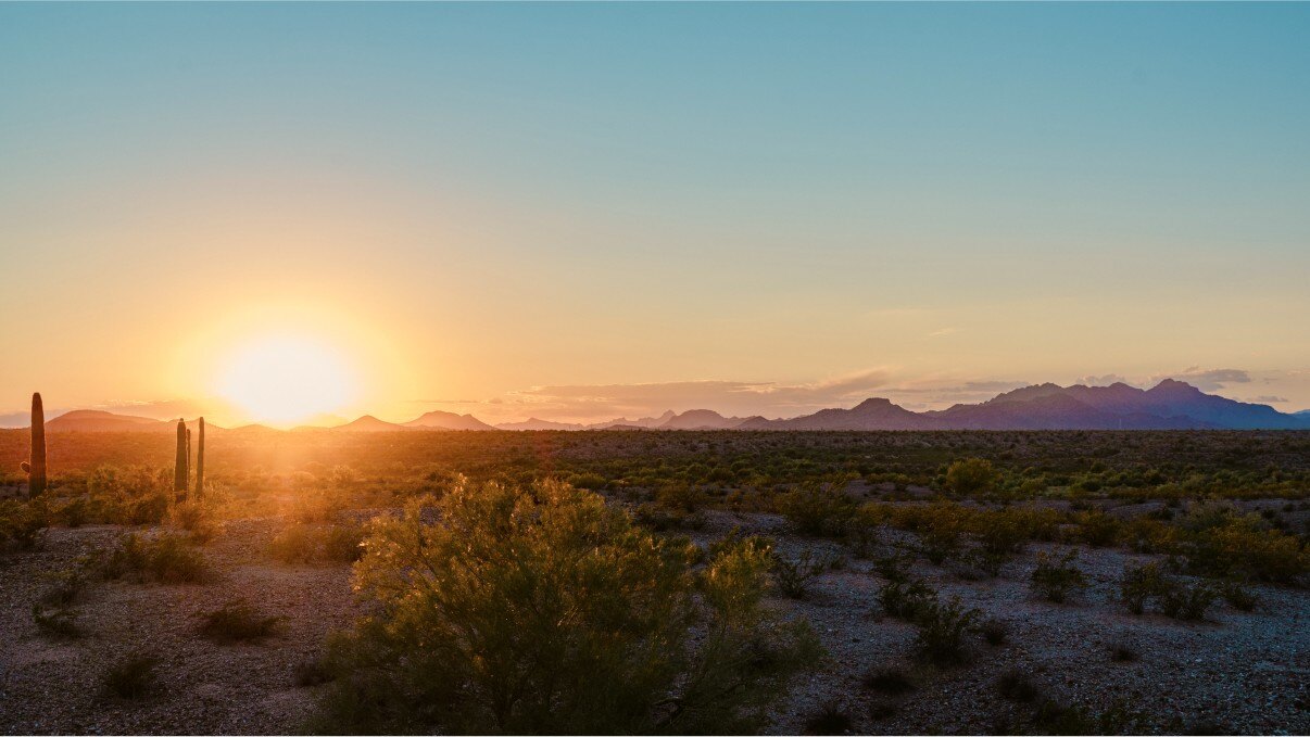 Desert sunset over mountain range in Buckeye